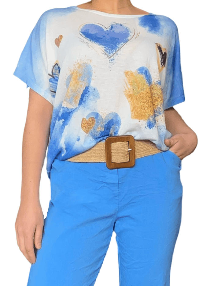 Chandail avec imprimé de cœurs bleu et or pour femme avec ceinture.