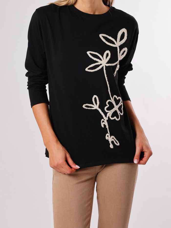NEW - Chandail noir avec fleur texturée blanche