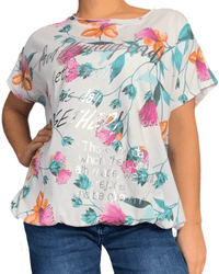 T-shirt blanc avec imprimé floral vert, orange et fuchsia pour femme.