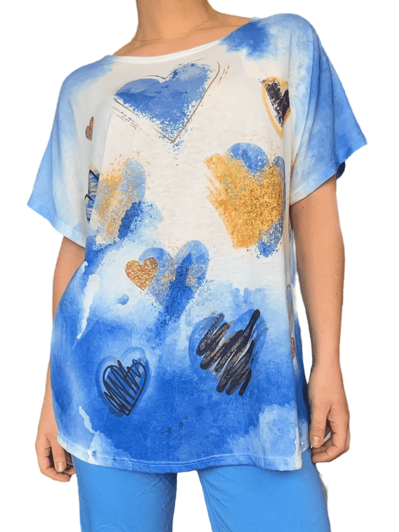 Chandail avec imprimé de cœurs bleu et or pour femme.