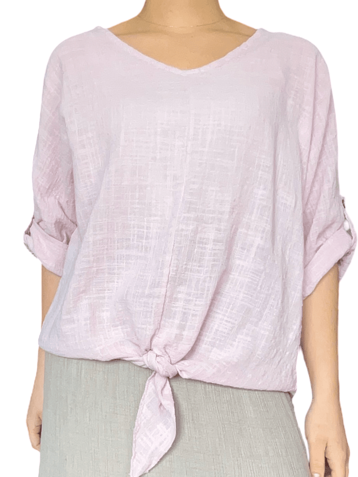 Chandail rose pâle à manches 3/4 pour femme.