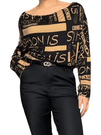 Chandail noir et bronze avec imprimé d'écritures pour femme avec pantalon.