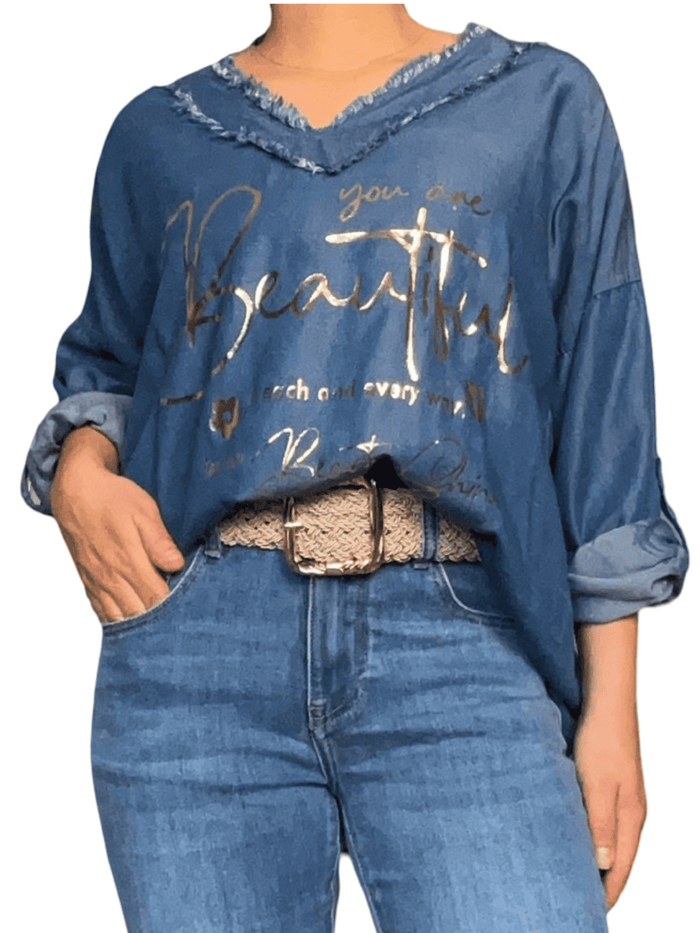 Chandail bleu jean avec franges pour femme avec ceinture.