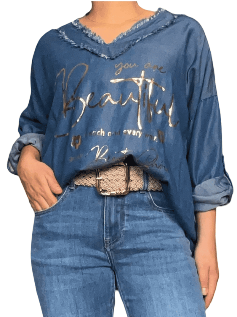 Chandail bleu jean avec franges pour femme avec ceinture.