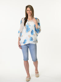 Chandail blanc en mailles avec imprimé floral bleu