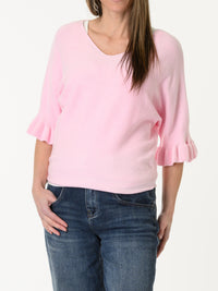 Chandail rose pâle à manche à volant