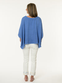 Chandail bleu jean avec bas effiloché