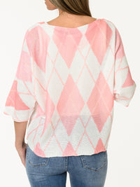 Chandail blanc en mailles à motifs de losanges corail