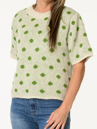 Chandail en tricot beige à motifs de pois verts