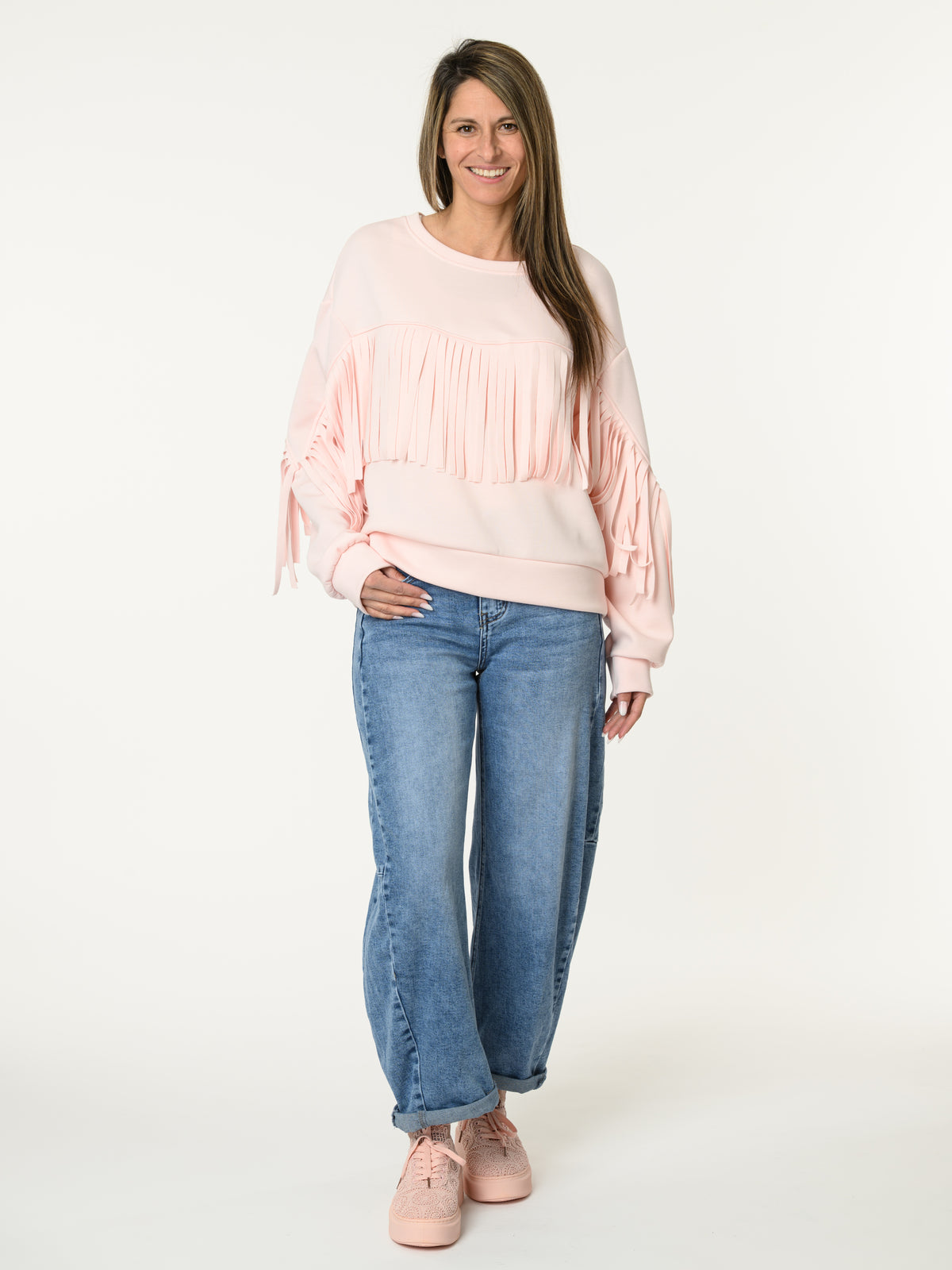Chandail rose pâle avec franges