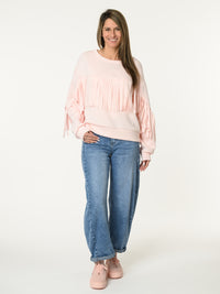 Chandail rose pâle avec franges