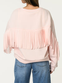 Chandail rose pâle avec franges