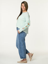 Chandail aqua avec lacets sur les côtés