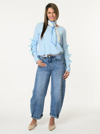 Chandail bleu ciel avec lacets sur les côtés