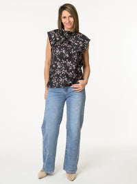 Blouse noire à col montant avec imprimé de fleurs