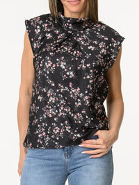 Blouse noire à col montant avec imprimé de fleurs