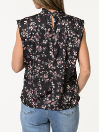 Blouse noire à col montant avec imprimé de fleurs