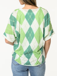 Chandail blanc à motifs de losanges verts