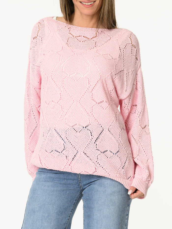 Chandail rose en tricot à motifs de cœurs