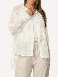 Chemise blanche à motifs de feuilles brodées