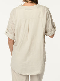 Blouse beige avec fleurs texturées