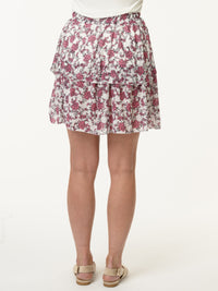 Jupe blanche à volants avec imprimé floral rose