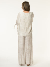 Chandail blanc et beige avec lacets sur les côtés