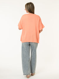 Veste corail en mailles avec boutons