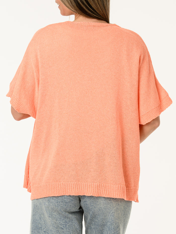 Veste corail en mailles avec boutons