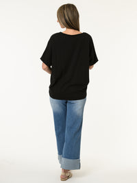 T-shirt noir avec imprimé de fleurs orange