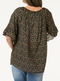 Blouse noire avec manches à volants à motifs de fleurs