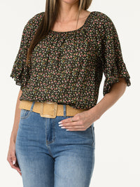 Blouse noire avec manches à volants à motifs de fleurs