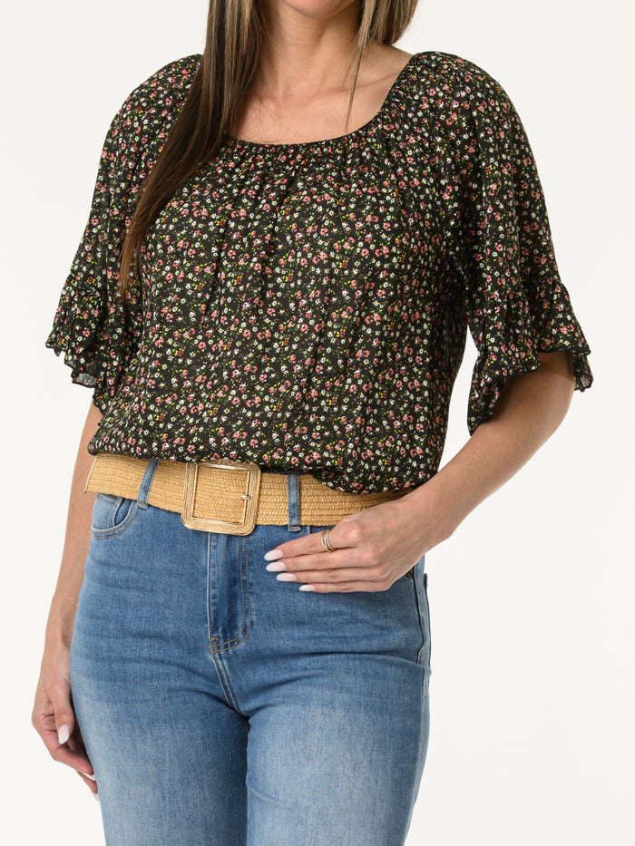 Blouse noire avec manches à volants à motifs de fleurs