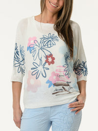 Chandail blanc avec imprimé de fleurs graphiques