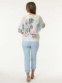 Chandail blanc avec imprimé de fleurs graphiques