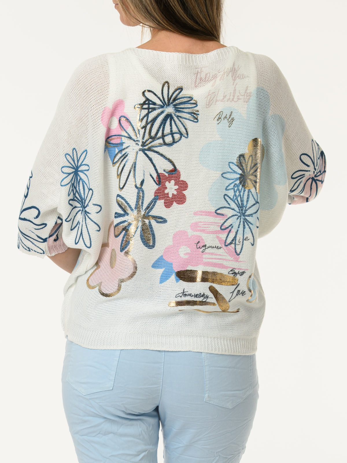 Chandail blanc avec imprimé de fleurs graphiques