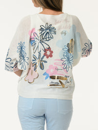 Chandail blanc avec imprimé de fleurs graphiques