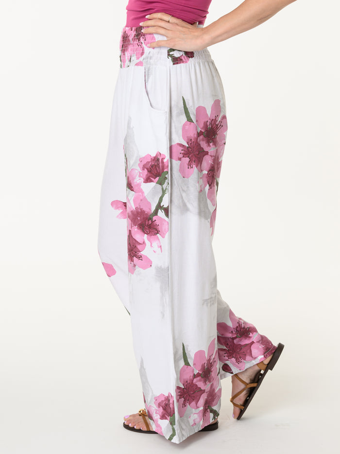 Pantalon palazzo blanc avec imprimé floral magenta