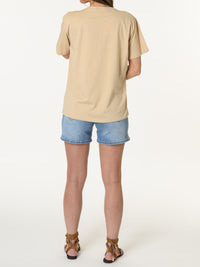 T-shirt beige avec trois fleurs brodés