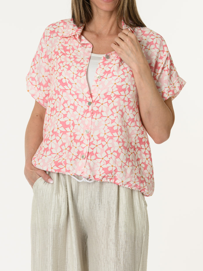 Chemise rose avec imprimé floral blanc