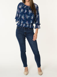 Blouse marine aux motifs floraux multicolores