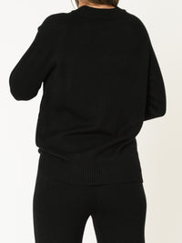 Chandail noir pour femme en tricot torsadé à col rond