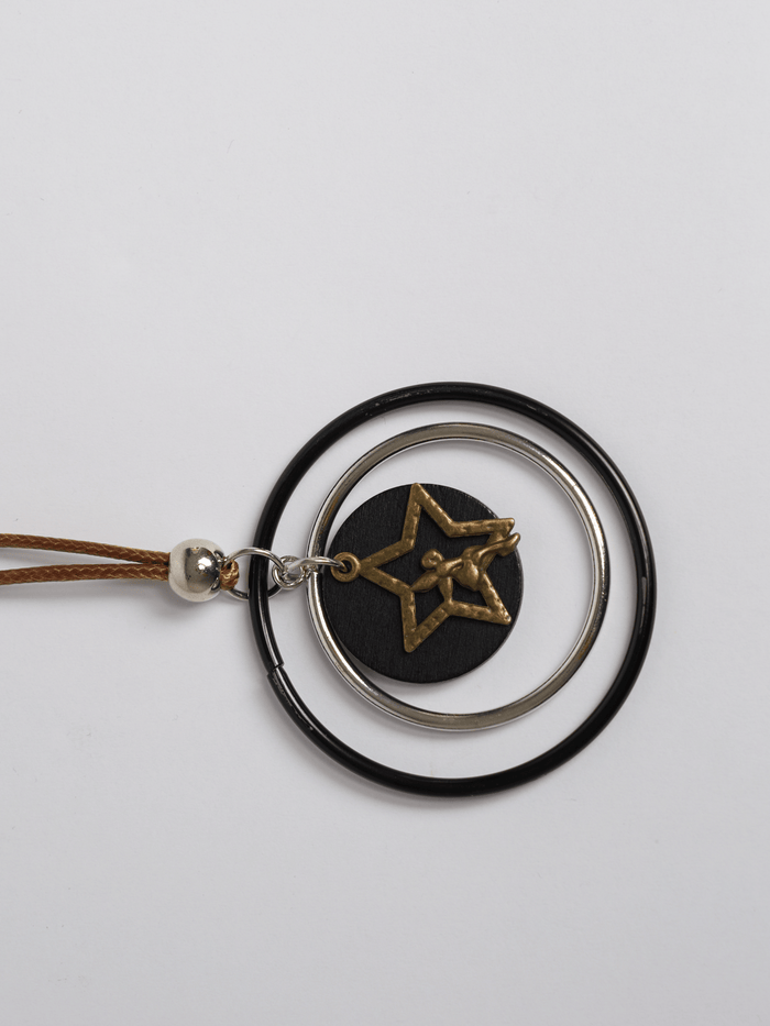 Bijoux | Collier long avec pendentif de pastille noire et étoile